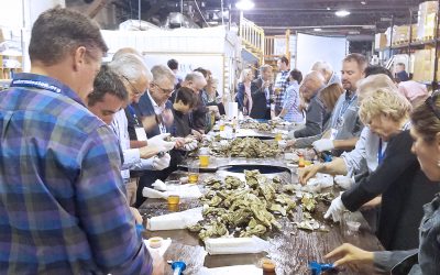 people enjoying oysters at an oyster roast in charleston sc